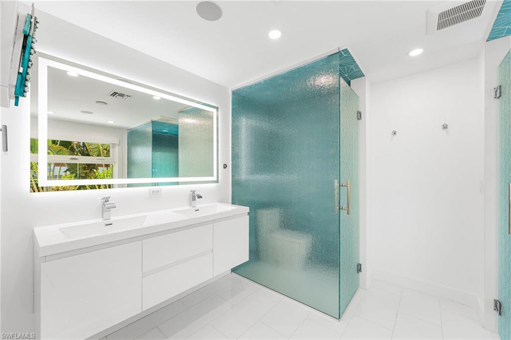 Quartz countertops and designer finishes throughout.