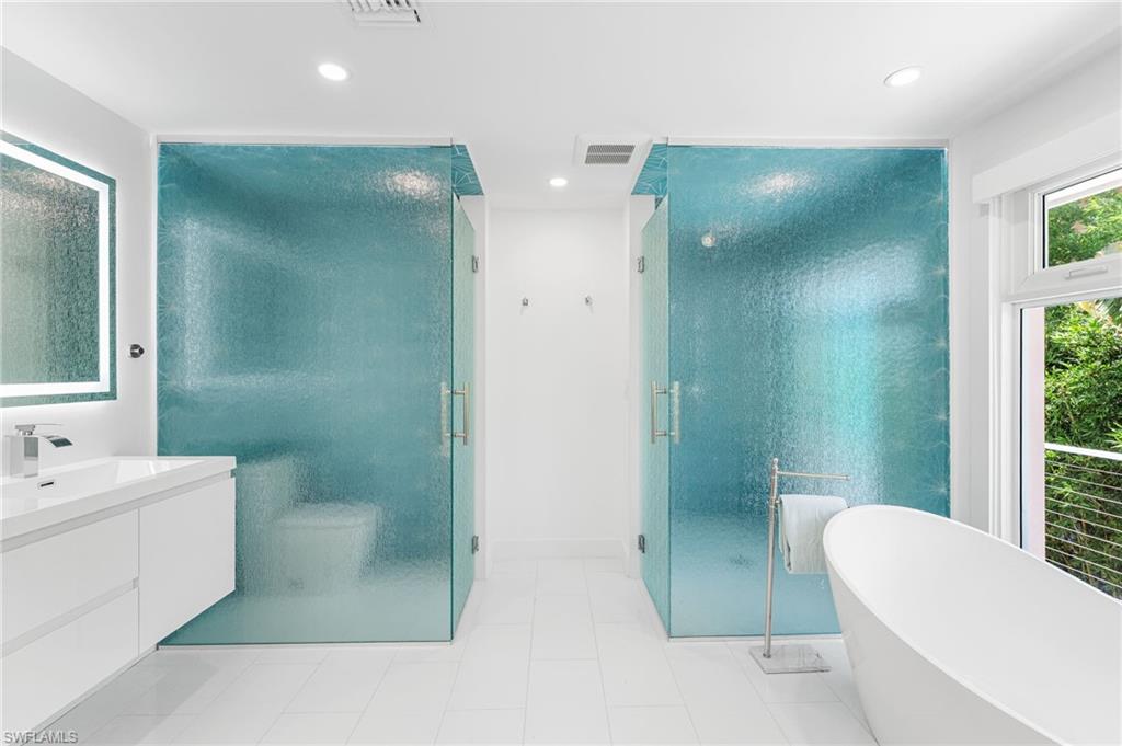 Quartz countertops and designer finishes throughout.