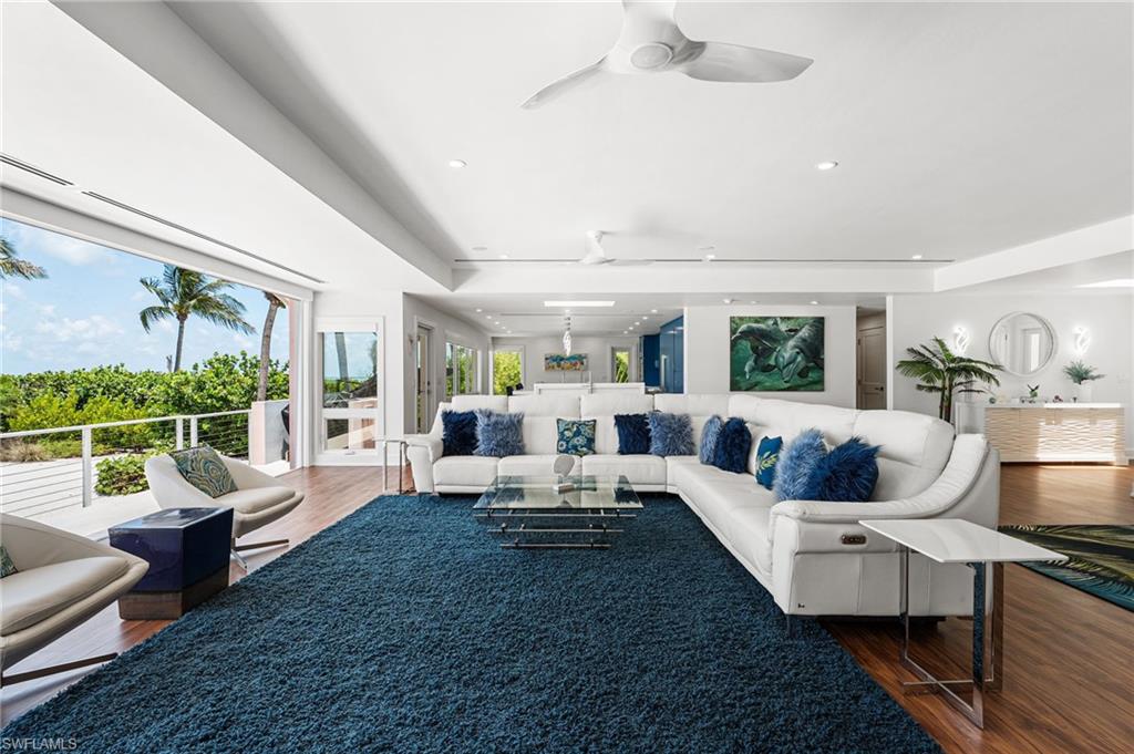 Light-filled living room with soaring ceilings and expansive glass.