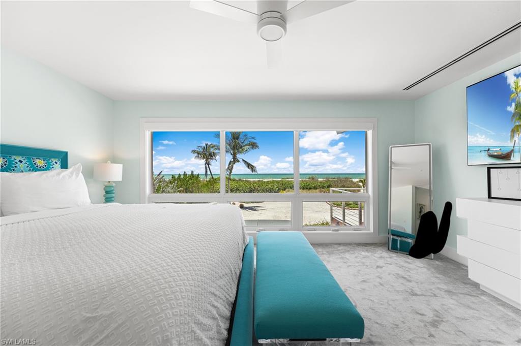 Primary suite featuring a peaceful beachfront setting.