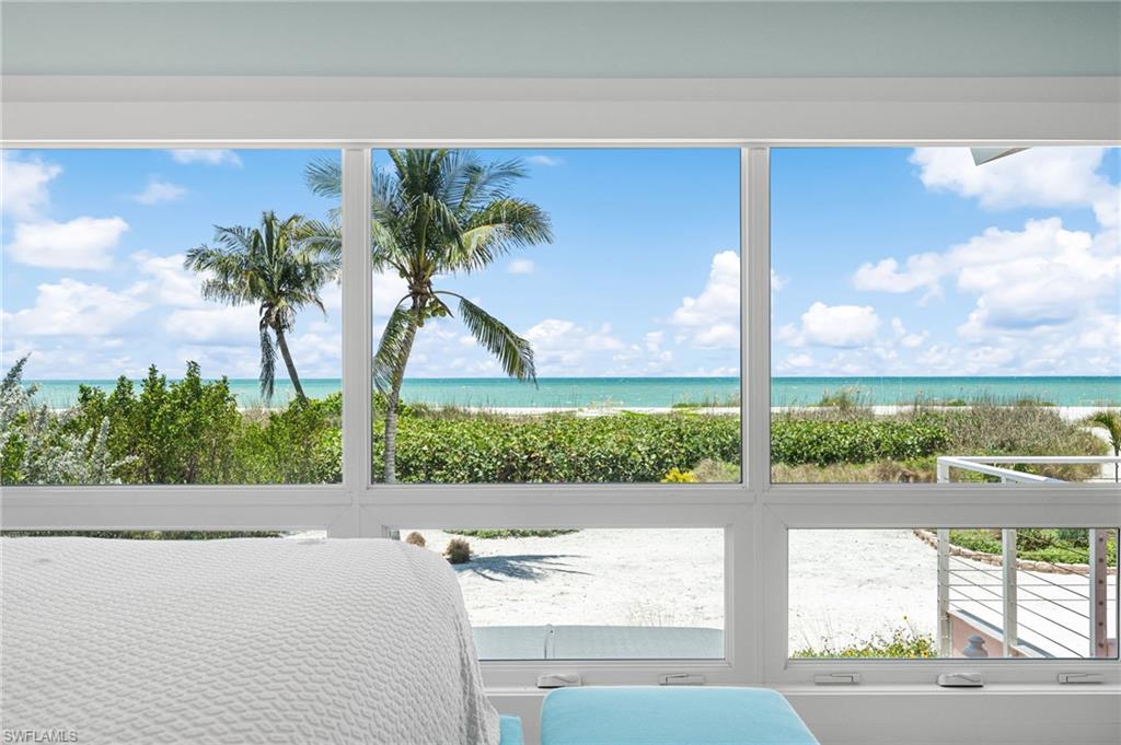 Primary suite featuring a peaceful beachfront setting.