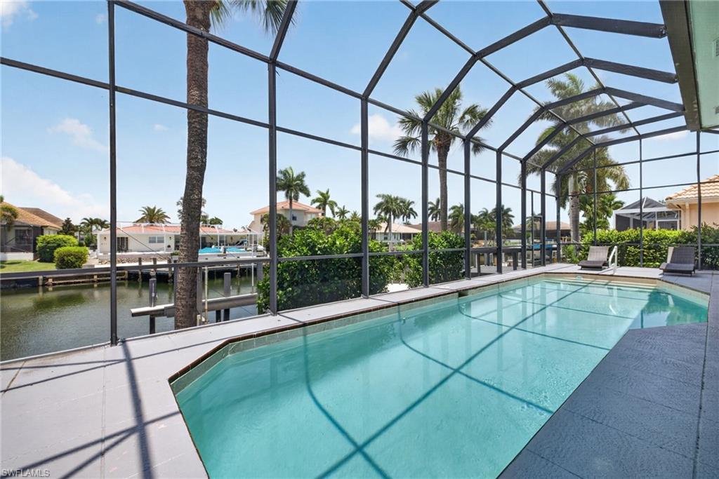 Large pool with Screened lanai