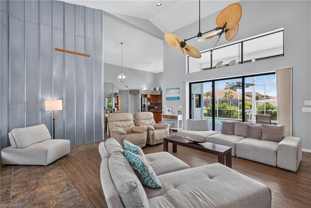 Large open living area with ultra high ceilings