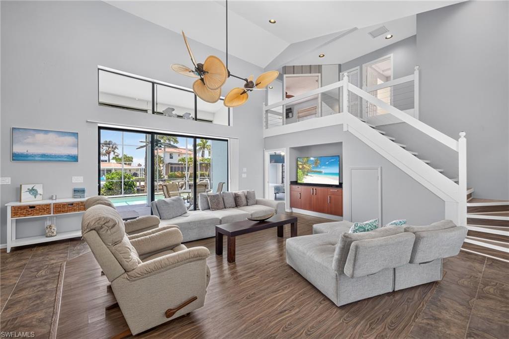 Large open living area with ultra high ceilings