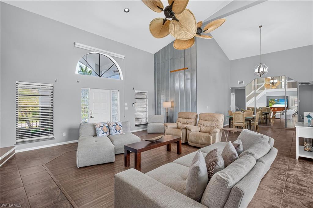 Large open living area with ultra high ceilings