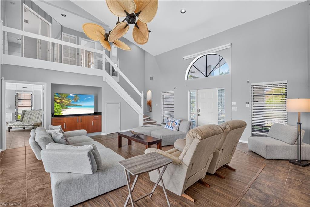 Large open living area with ultra high ceilings