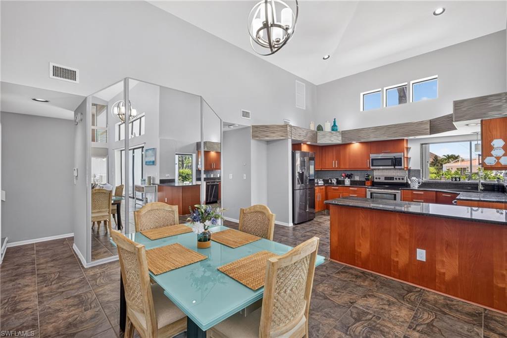 Dining area with access to large living area and kitchen