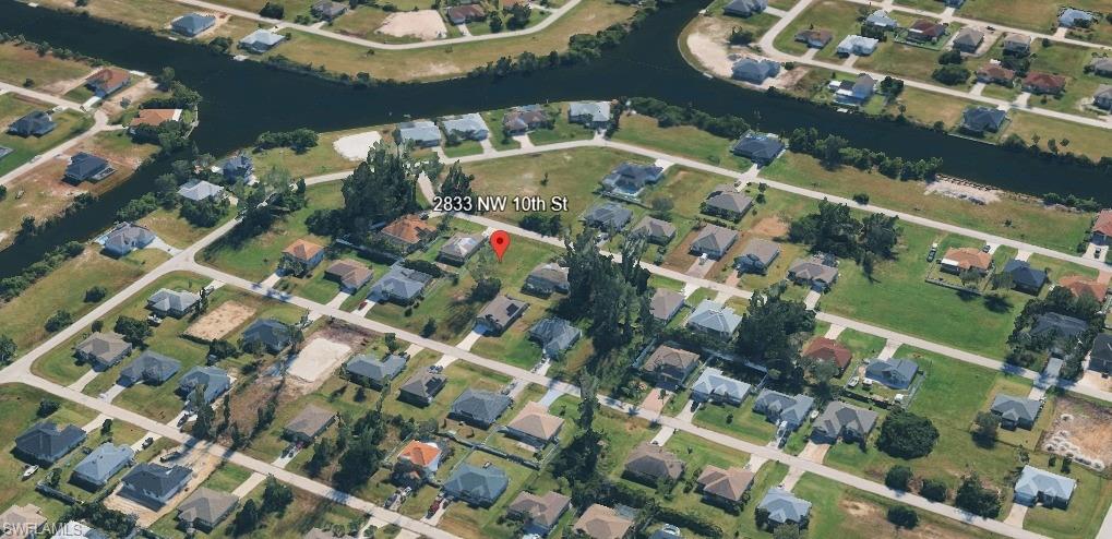 View of property location featuring nearby suburban area
