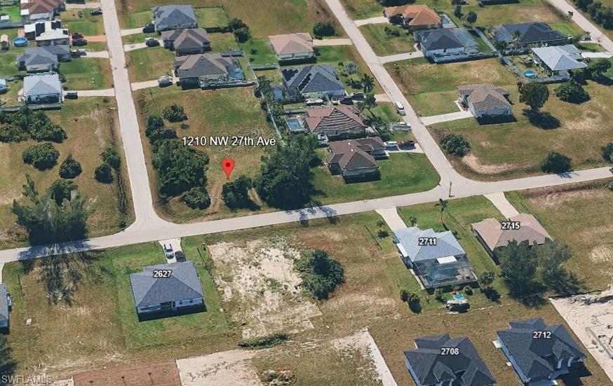View of property location featuring nearby suburban area