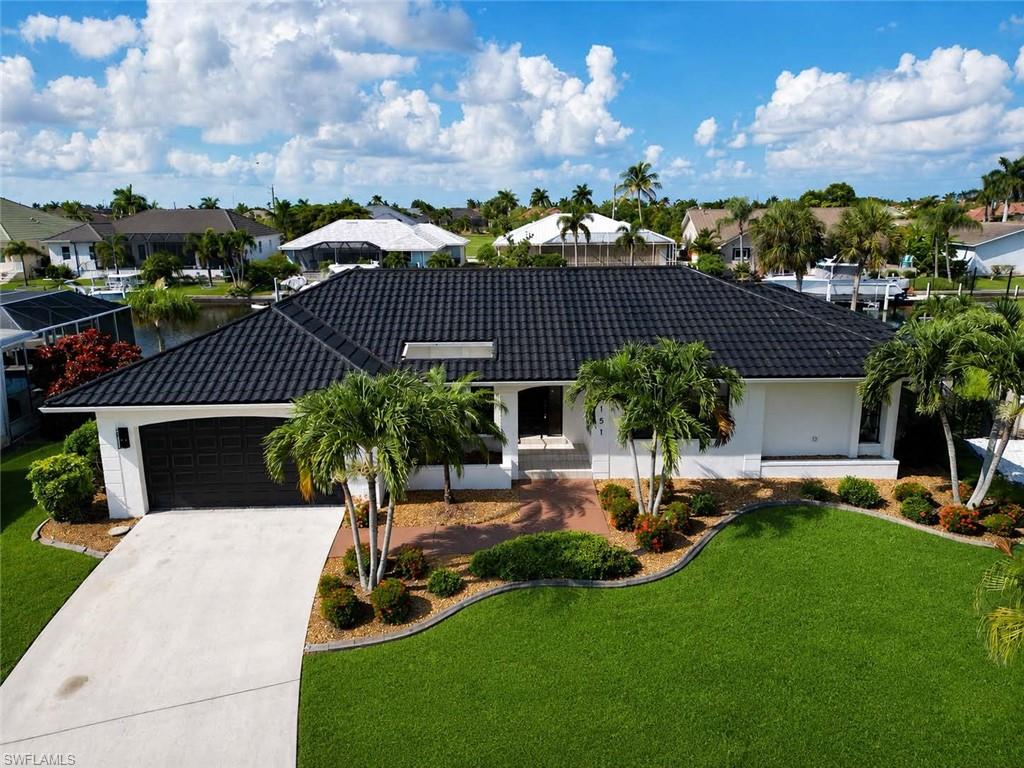 Beautiful curb appeal with manicured landscaping