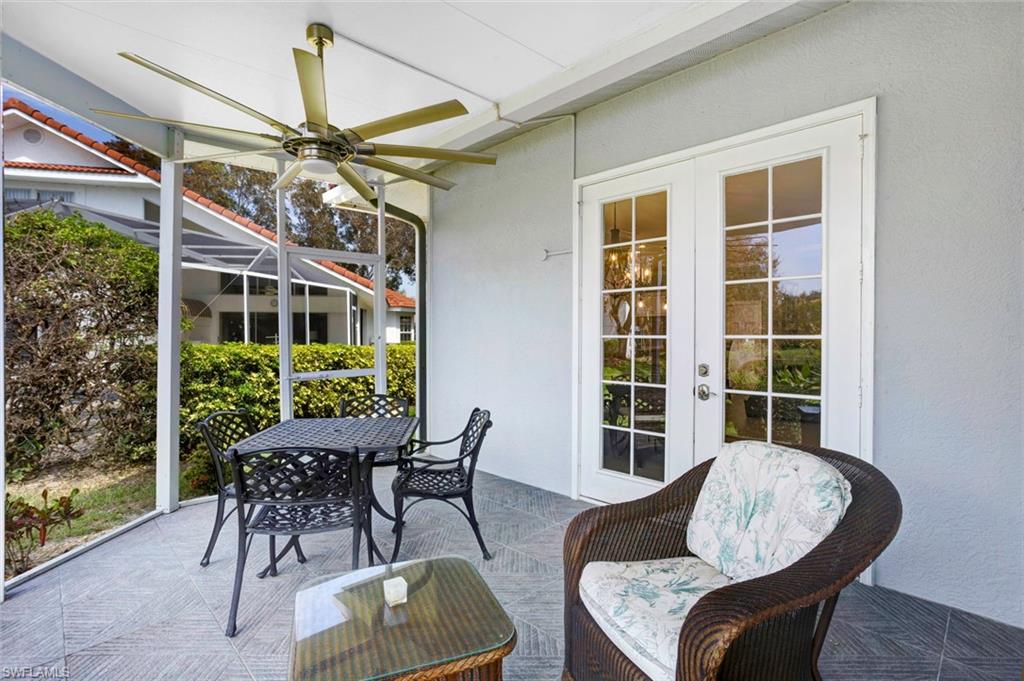 Sunroom featuring french doors and ceiling fan