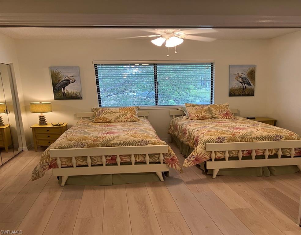 Bedroom featuring ceiling fan and light hardwood / wood-style floors