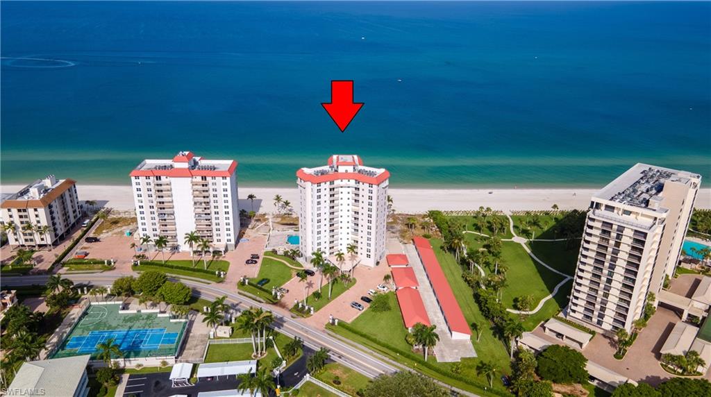 Beachfront high-rise building featuring multiple stories and private balconies