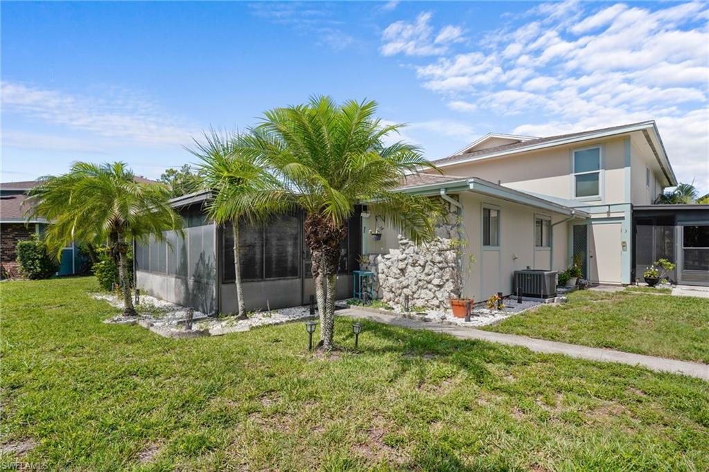 5848 Queen Elizabeth Way Unit #1 - One story, only one shared wall. Pool is just outside door.Large, screened lanai with all-season windows and nicely tiled.