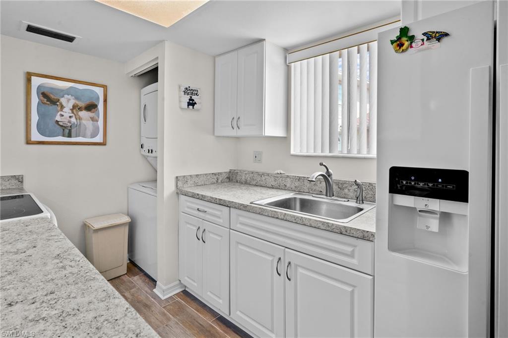 Kitchen. Nice window over the sink for lots of natural light. Updated cabinetry and countertops. Range/oven, washer/dryer, refrigerator with water/ice on the door. All kitchen items are included.