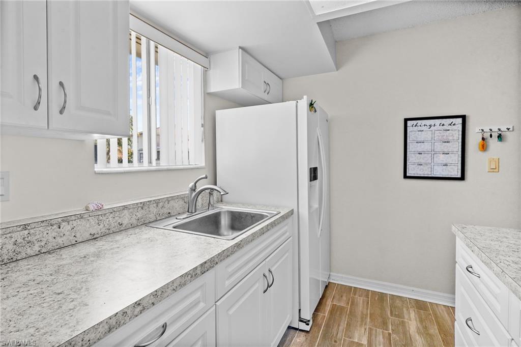 Kitchen. Nice window over the sink for lots of natural light. Updated cabinetry and countertops. Range/oven, washer/dryer, refrigerator with water/ice on the door. All kitchen items are included.