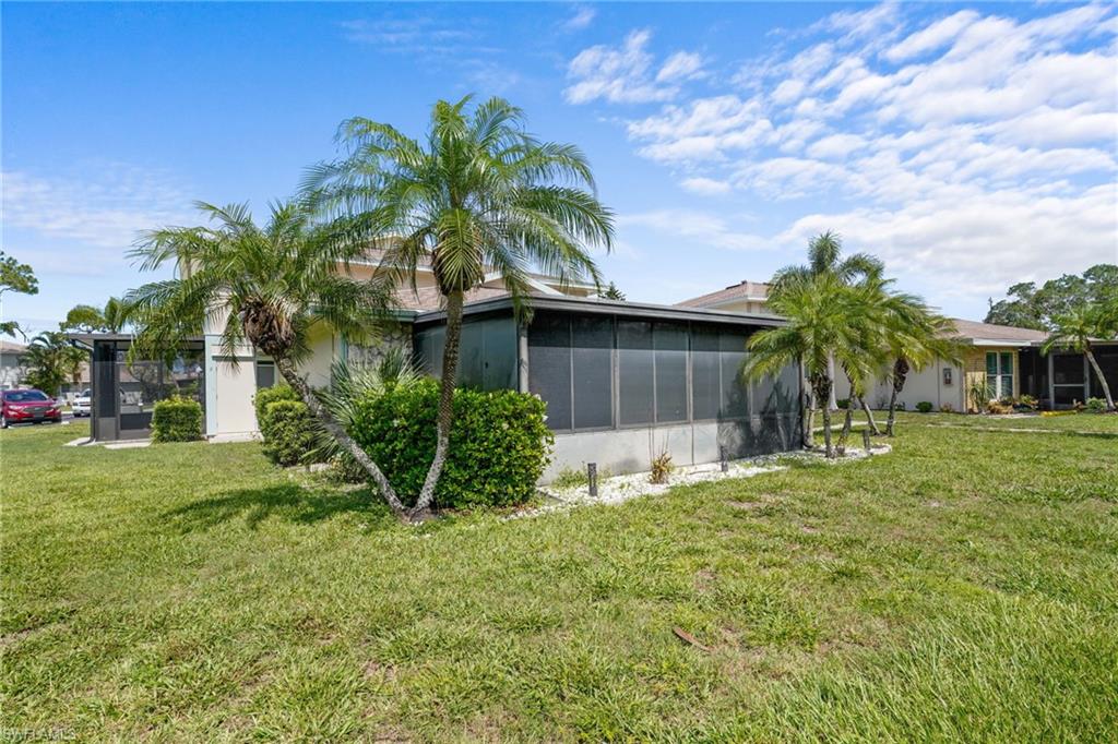 5848 Queen Elizabeth Way Unit #1 - One story, only one shared wall. Pool is just outside door.Large, screened lanai with all-season windows and nicely tiled.
