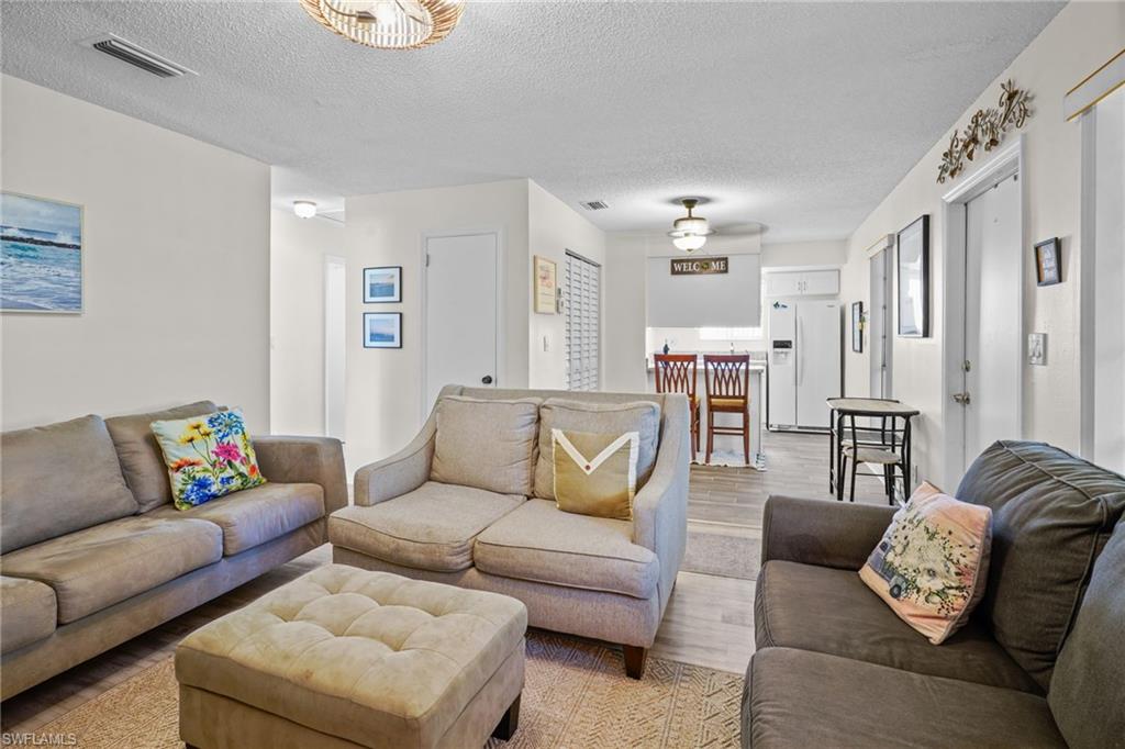 Fully Turn-key (everything included). Gorgeous upgraded, tile flooring.Just bring your bags and head for the pool. Large front windows for lots of natural light. Front door and large window, breakfast bar. All appliances included.