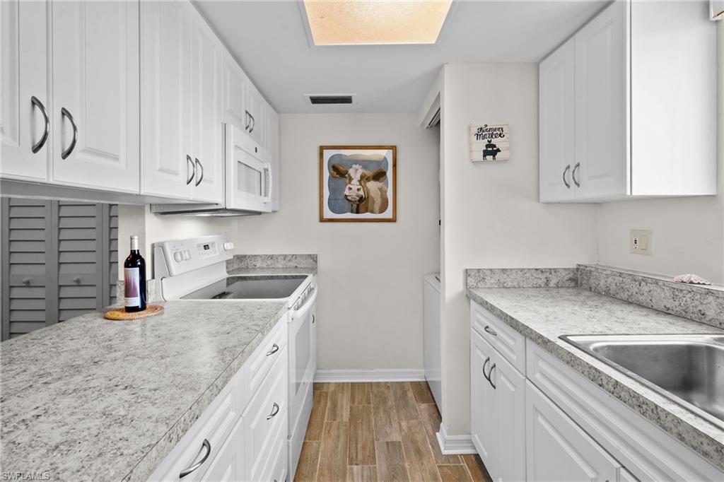 Kitchen. Nice window over the sink for lots of natural light. Updated cabinetry and countertops. Range/oven, washer/dryer, refrigerator with water/ice on the door. All kitchen items are included.