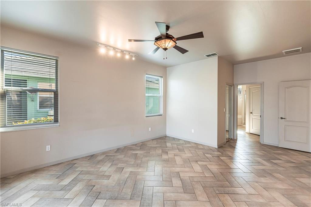 Hurricane rated windows with custom blinds leading to closet, primary bathroom or den or living room. Light and privacy for your new special spot!