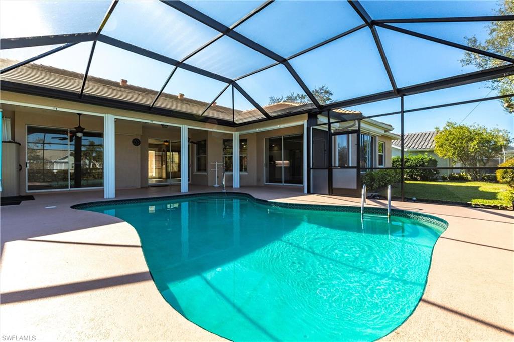 View of swimming pool looking toward your new home, makes you want to jump right in, doesn't it?