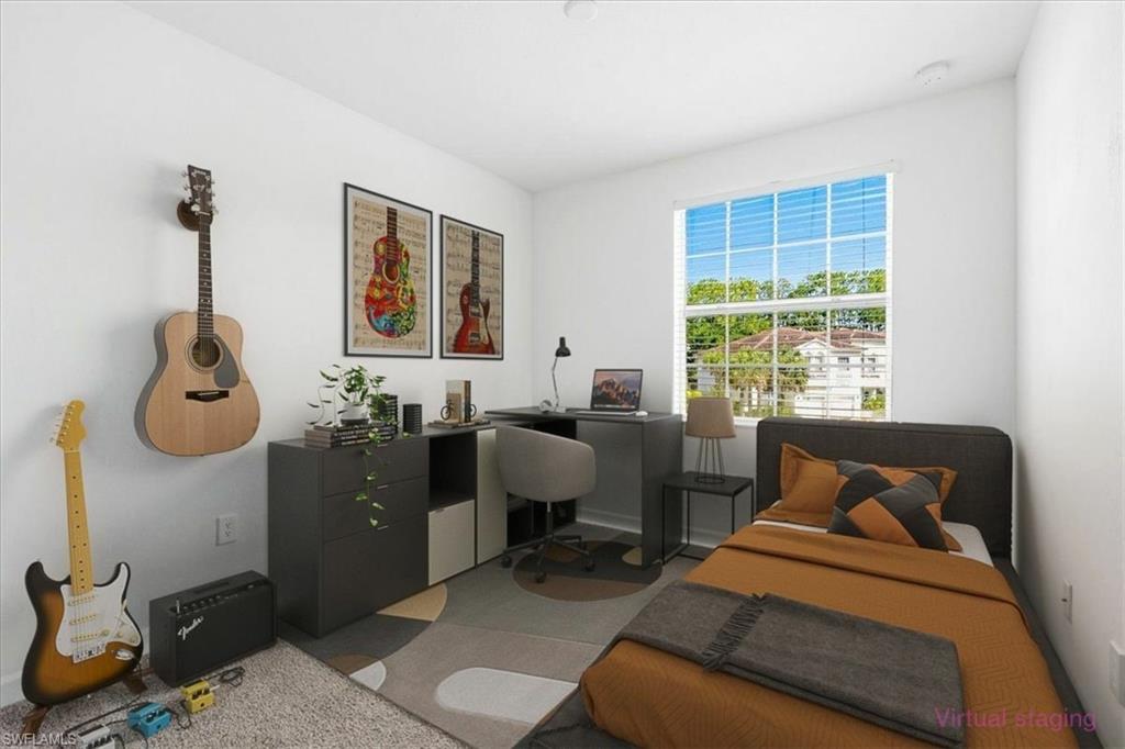 #3 Bright interior room featuring a large window with horizontal blinds, neutral wall paint, recessed lighting, and wood-finish flooring