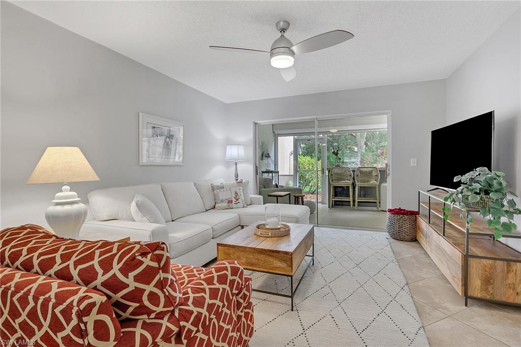 Living room with access to sitting room, northern exposure; primary bedroom to the right