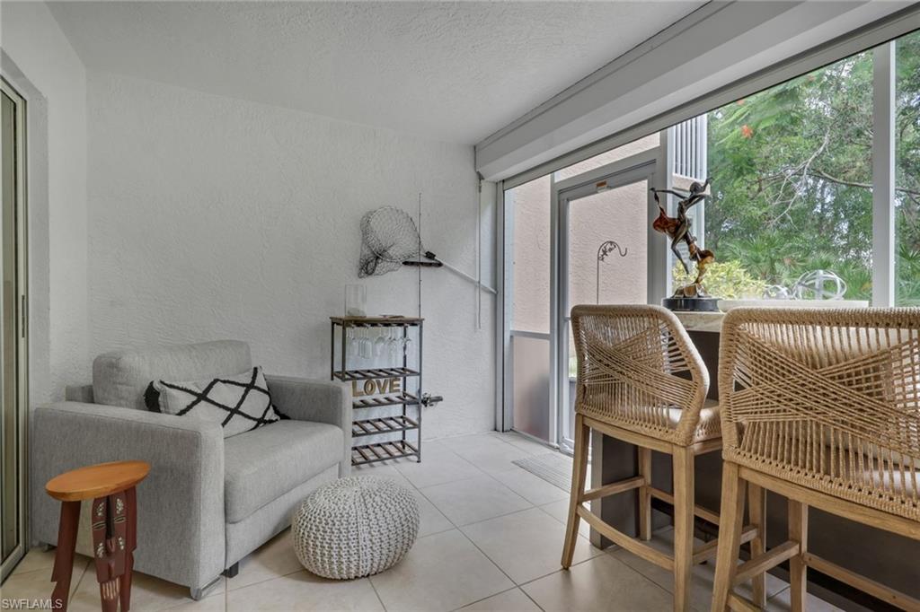 Enclosed area overlooking landscaped area; electric storm shutter