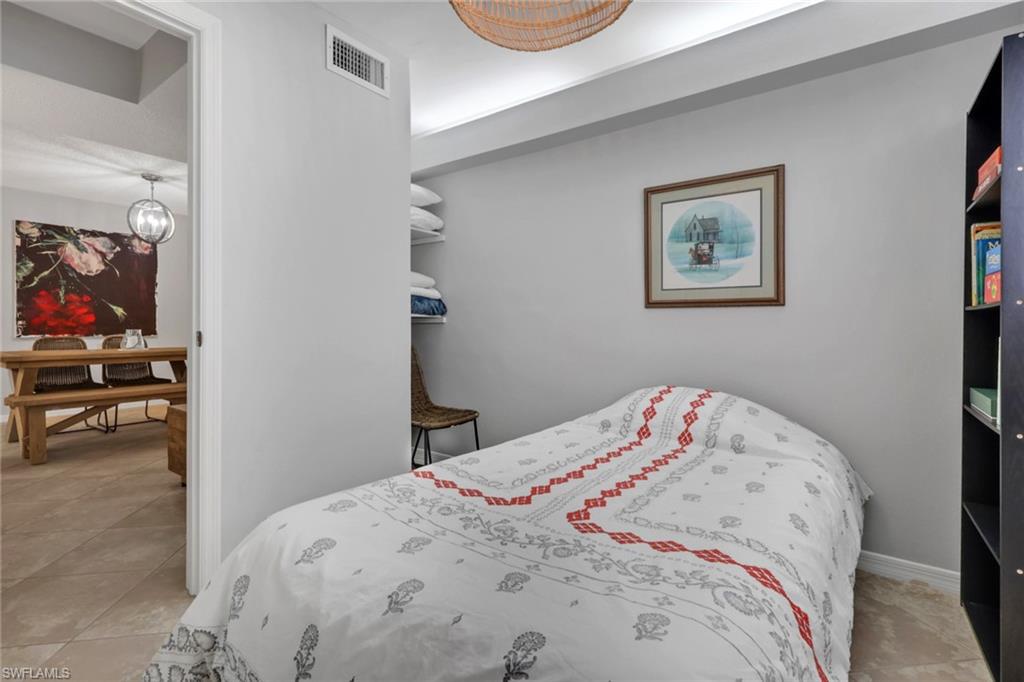Den area with storage shelving to the rear left
