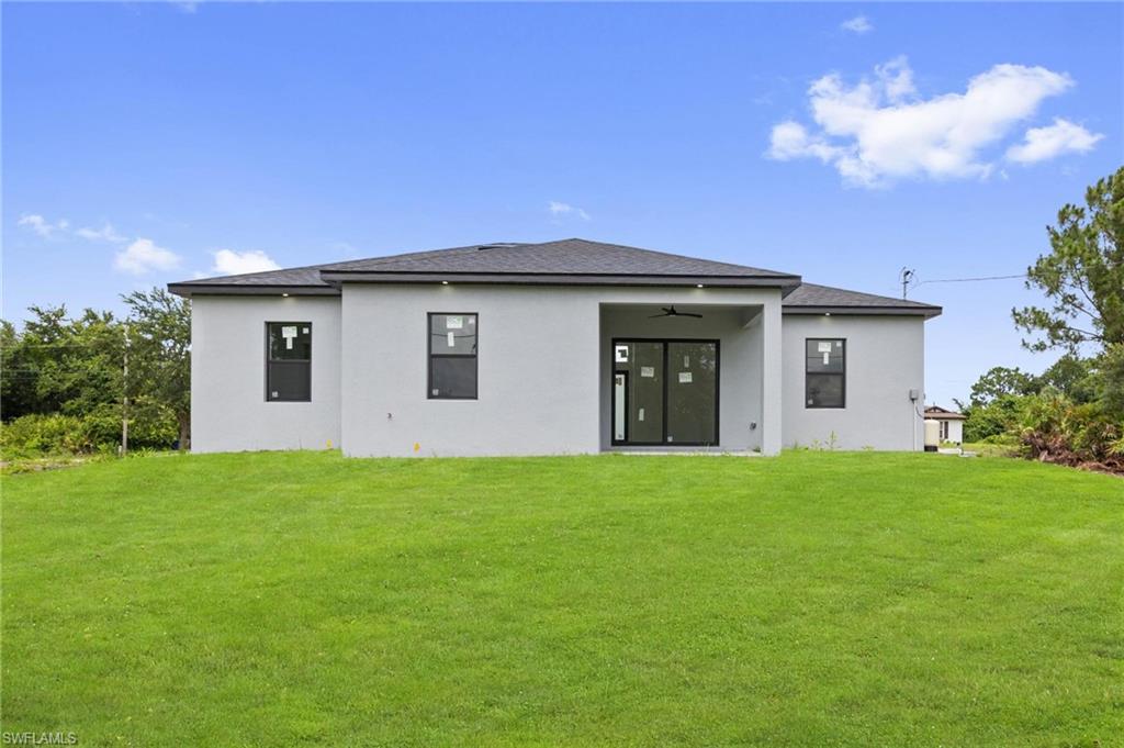 Spacious rear yard with a manicured lawn