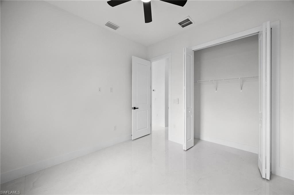 Interior room featuring light-toned flooring and white walls