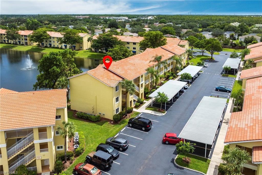 Aerial view of apartment complex and a nearby body of water