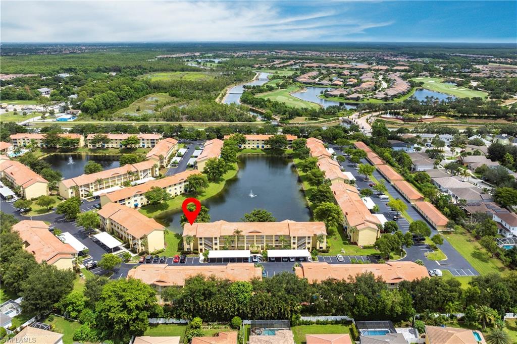 View of property location with a large body of water and nearby suburban area