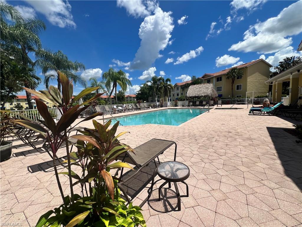 Community pool featuring a patio