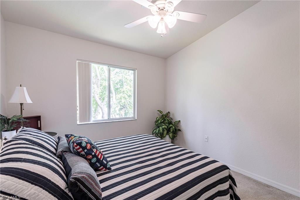 Bedroom with carpet and a ceiling fan