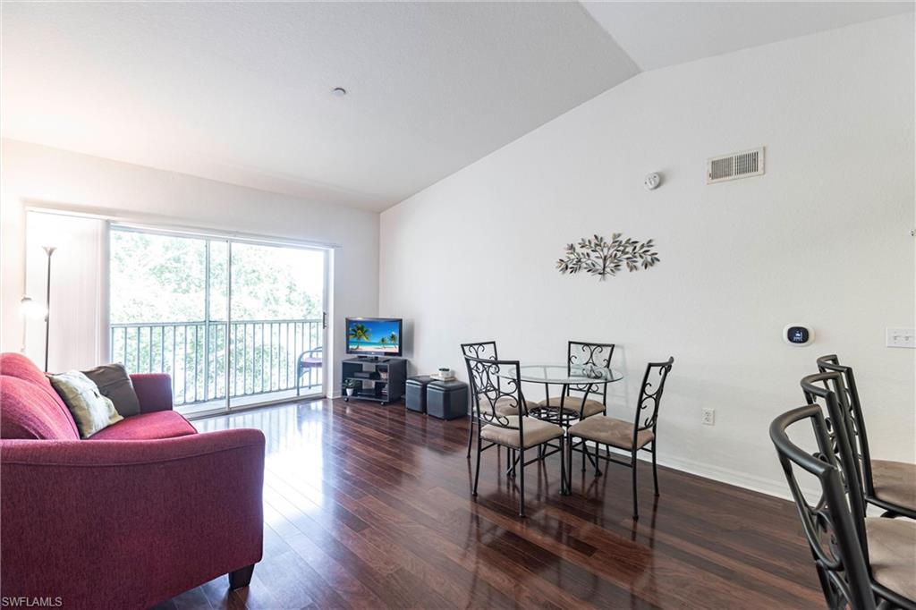Dining room with vaulted ceiling and wood finished floors