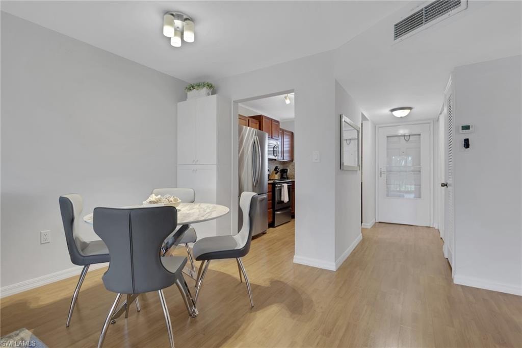 Light wood-finish flooring throughout the space