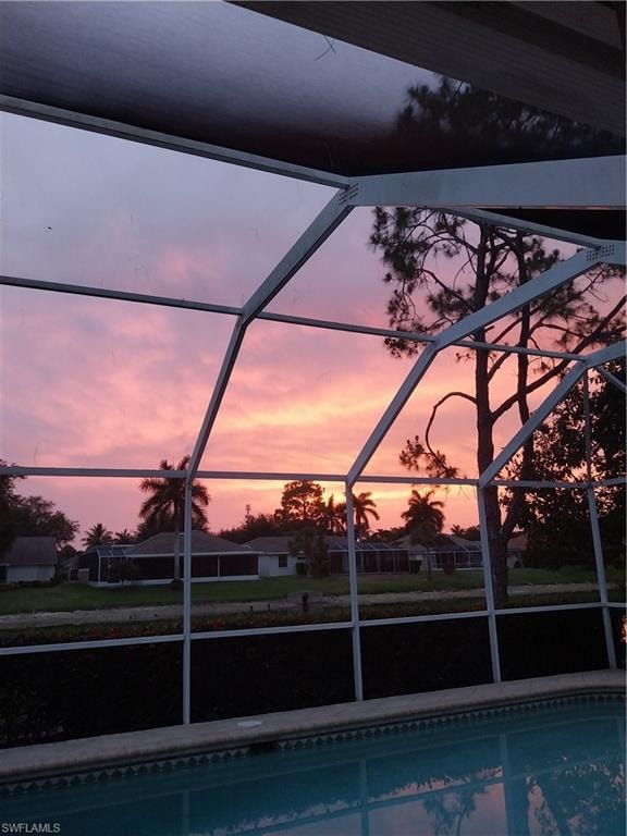 Outdoor pool featuring glass enclosure