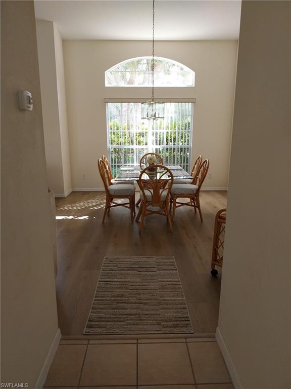 Dining room featuring a chandelier and light wood finished floors