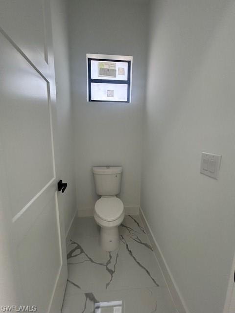 Bathroom with marble finish flooring and baseboards