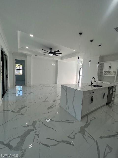 Kitchen featuring white cabinetry, light stone counters, light marble finish flooring, a ceiling fan, and recessed lighting