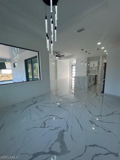 Unfurnished room with light marble finish flooring, recessed lighting, and ceiling fan