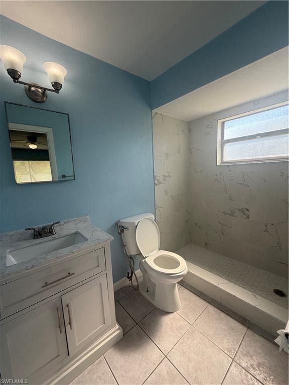 Bathroom featuring a walk-in shower with white veined tile surround, a white vanity with a marble-finish countertop and integrated sink, a wall-mounted rectangular mirror, and a two-light vanity fixture