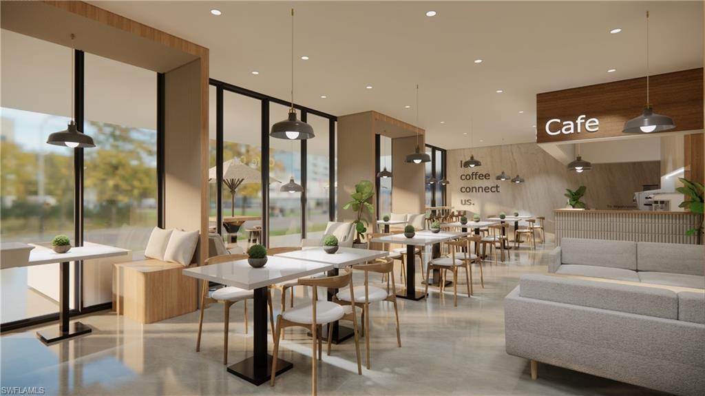 Lobby with floor to ceiling windows, wood walls, and recessed lighting