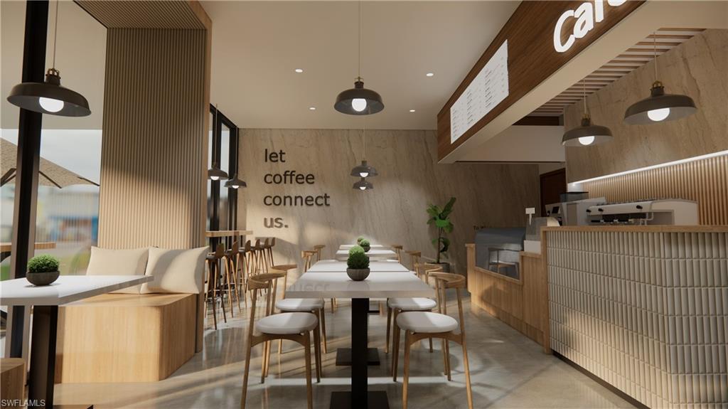 Dining space featuring concrete flooring, recessed lighting, and wood walls