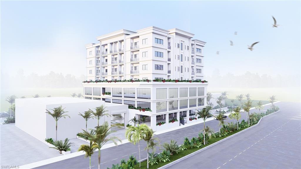 View of apartment building / complex with a water view