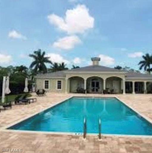 Community pool featuring a patio area