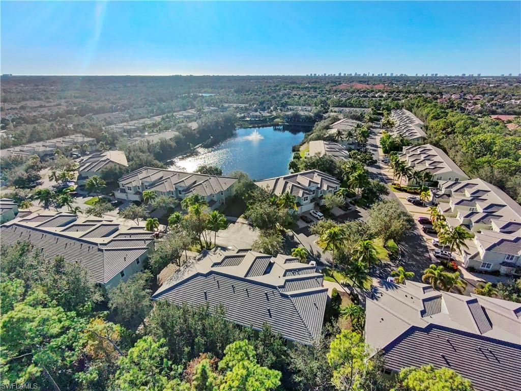 Aerial perspective of suburban area with a nearby body of water