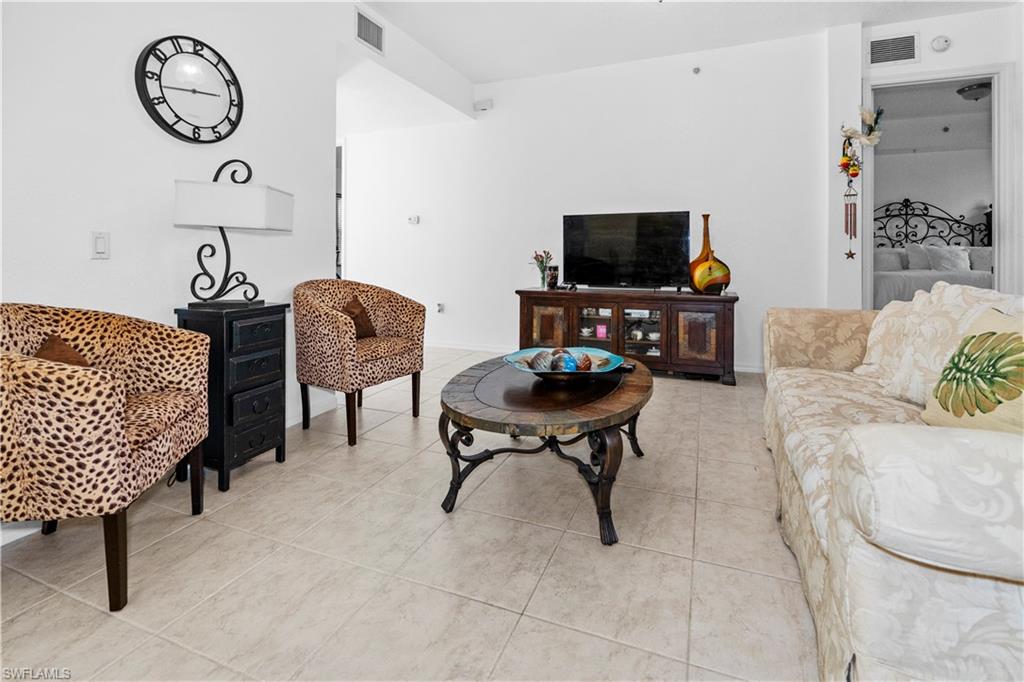 Living area with light tile patterned floors