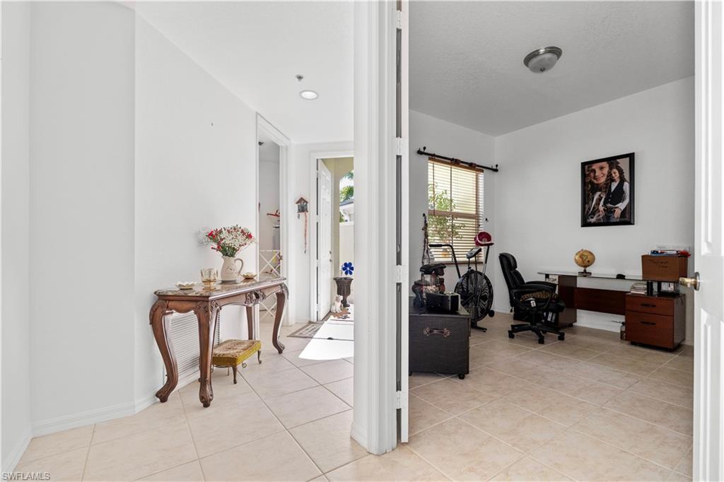 Office area featuring baseboards and light tile patterned floors
